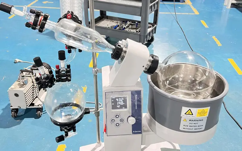 Rotary Evaporator Common Mistakes Warning sign in a lab next to a rotary evaporator